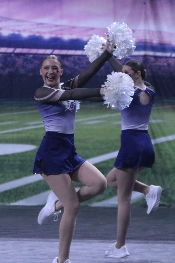 With a smile on her face, sophomore Ashley Ayers pops her knee up to pose. 
