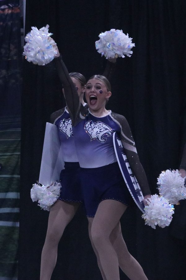 Entering the stage for the final routine of the day, junior Halle Wampler leads the team in with confidence. 
