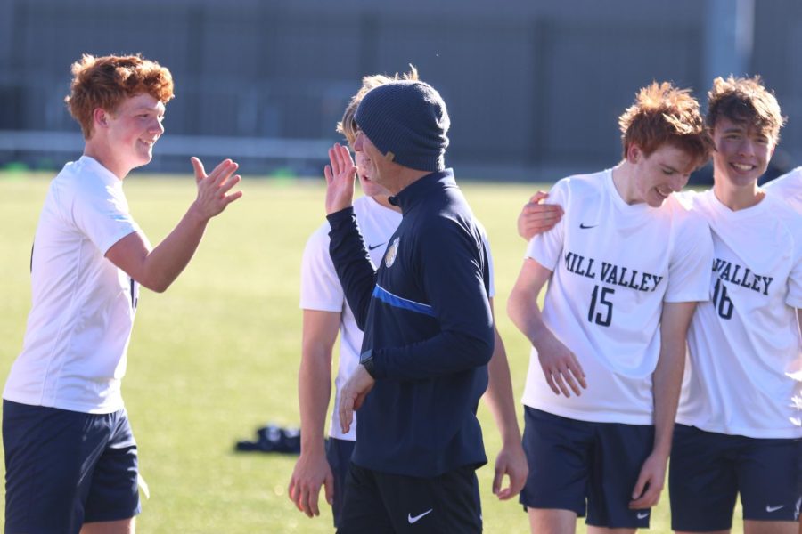 Senior Owen Peachee and head coach Jason Pendleton go in for a handshake after winning the state championship.
