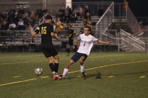 Senior Jack Gilmore runs to the ball to kick it before his opponent does. Soccer will be attending the 6A state tournament in Wichita Friday, Nov. 4 to Saturday, Nov. 5.