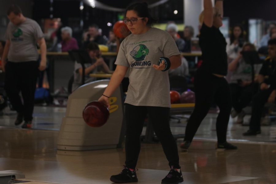 Letting go of the ball, junior Mya Diacono rolls the ball down the lane. 
