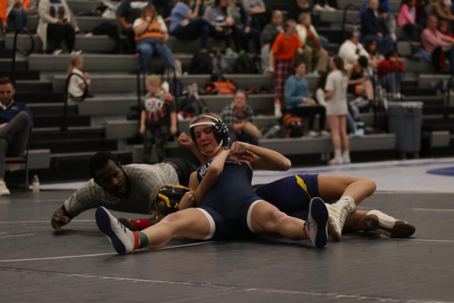 Pinning down her opponent, junior Emily Summa ensures her opponent cannot get up.