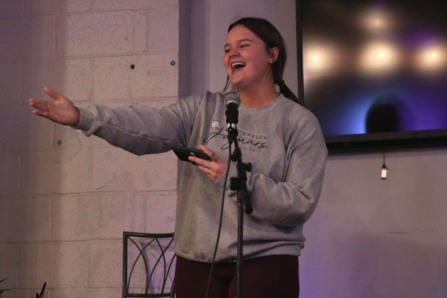 Pointing to the crowd, junior Kathryn Yockey sings “Part of Your World” from the Disney movie “The Little Mermaid.”
