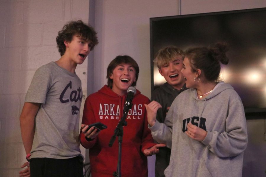 Freshman Reece Riedel, Gavin Hurt, Gus Goetsch and sophomore Josie Mason sing  “All I Want For Christmas Is You” by Mariah Carey 