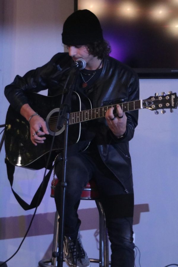 Trent Richardson performs an original song on his guitar. 
