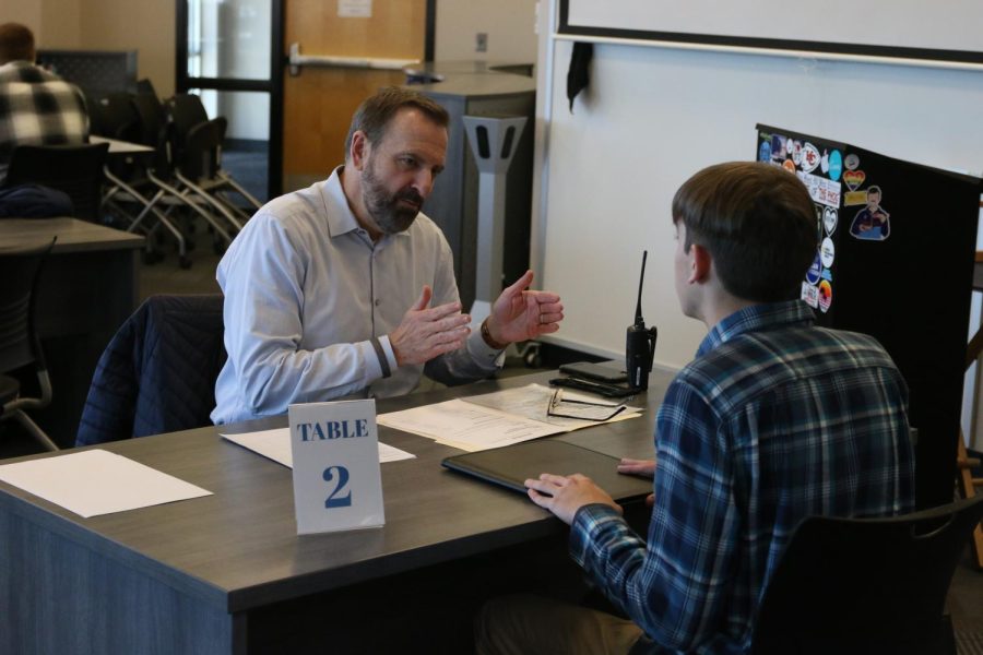 Listening intently, junior Jack Kellogg gets feedback on his mock-interview from his interviewer.