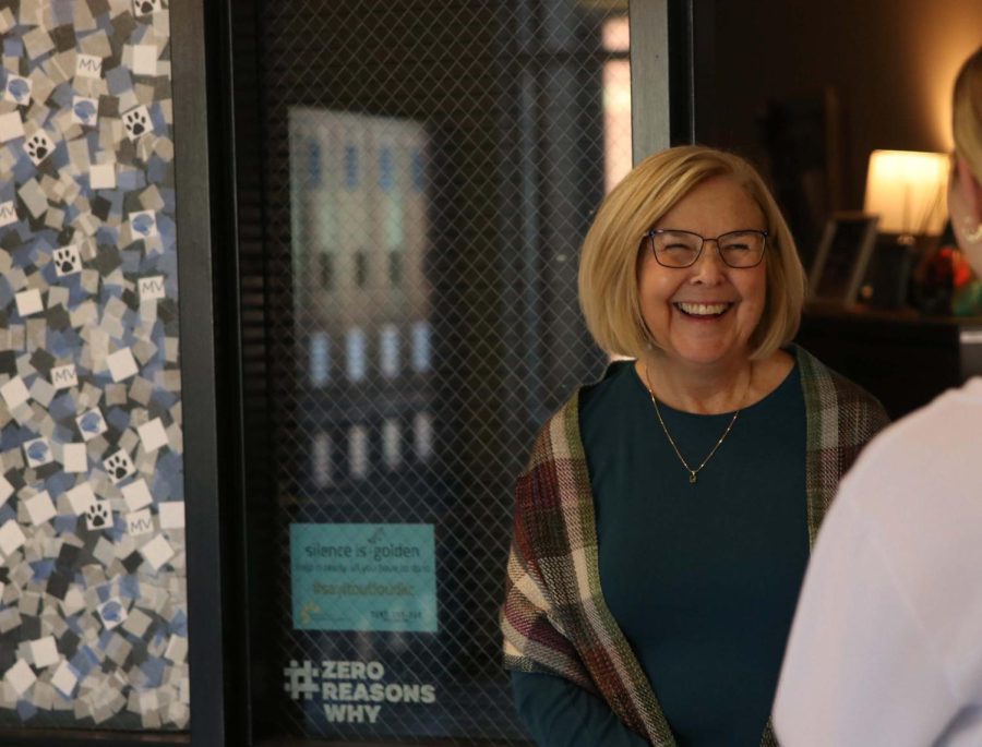 Standing outside her office, school social worker Debbie Gudenkauf talks with a student Wednesday, Nov. 30