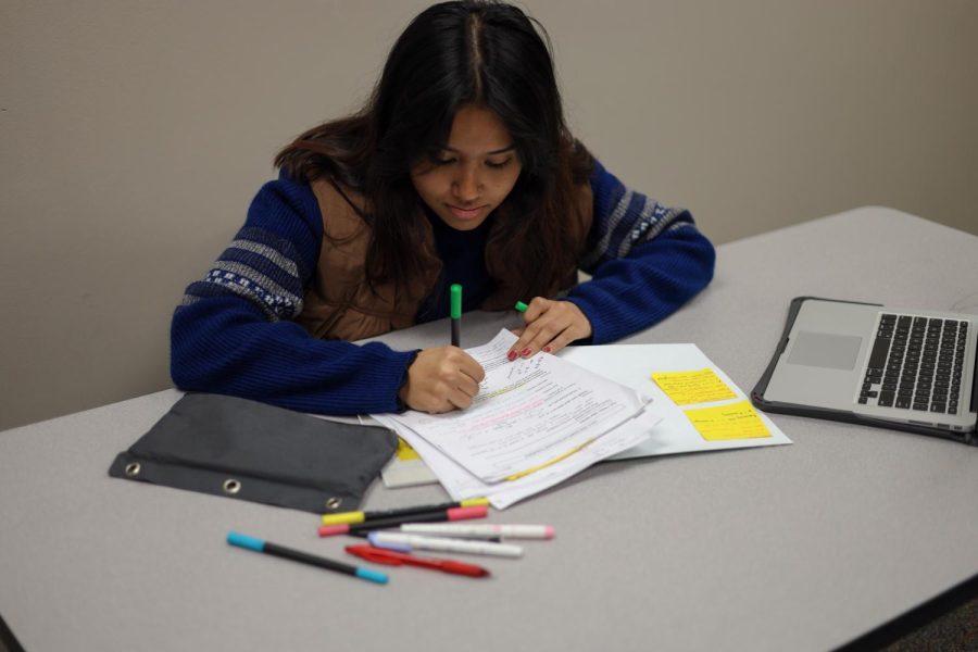Senior Abhi Raut prefers to write down what she learns during class to help her study for upcoming tests.