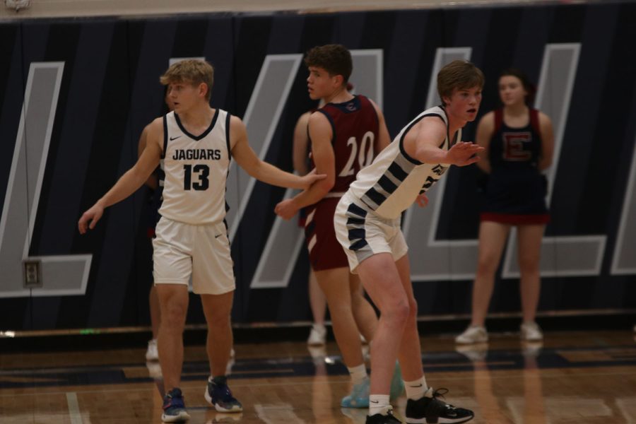 Arms out on defense, junior Bryant Wiltse and sophomore Carter Kaifes look to steal the pass. 
