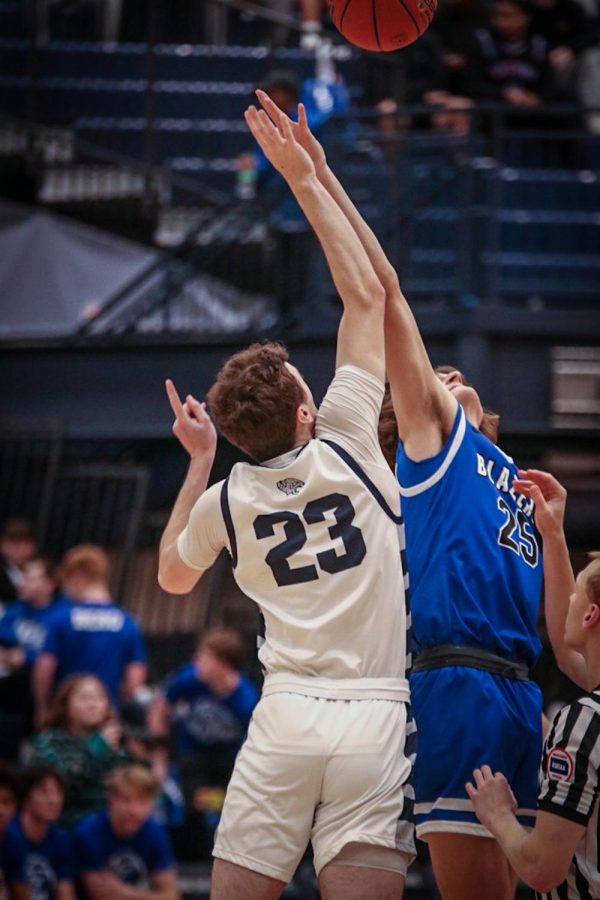 Starting another first half drive, senior Ryan Cummings attempts to steal the ball from Gardner Edgerton.