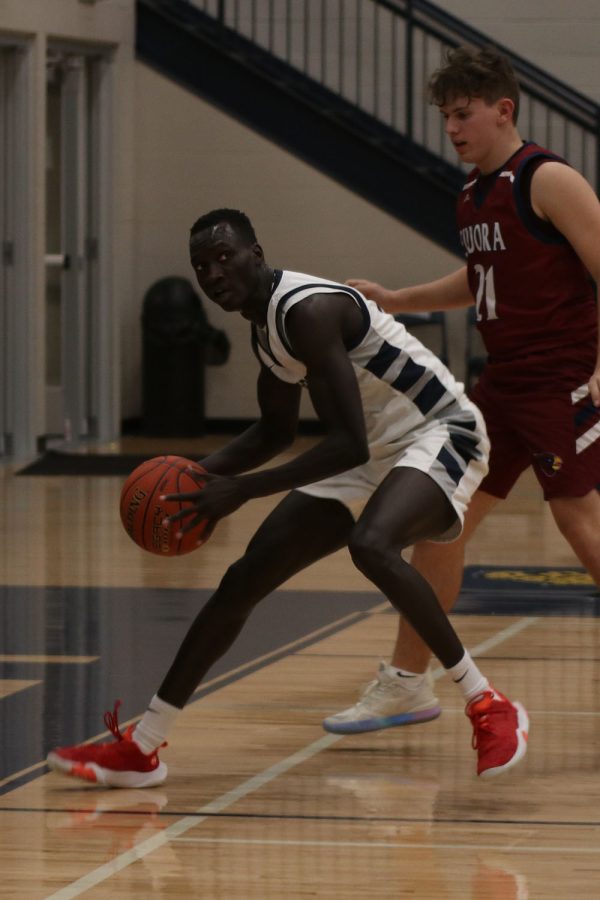 Dribbling backwards, senior Nen Matlock gets in position to score.
