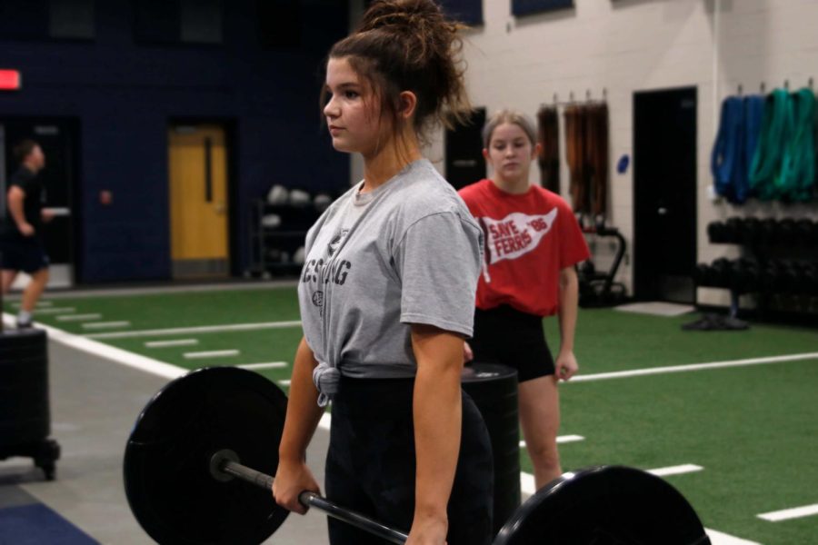 Freshman Ava Lucht rests for a moment before lifting again.