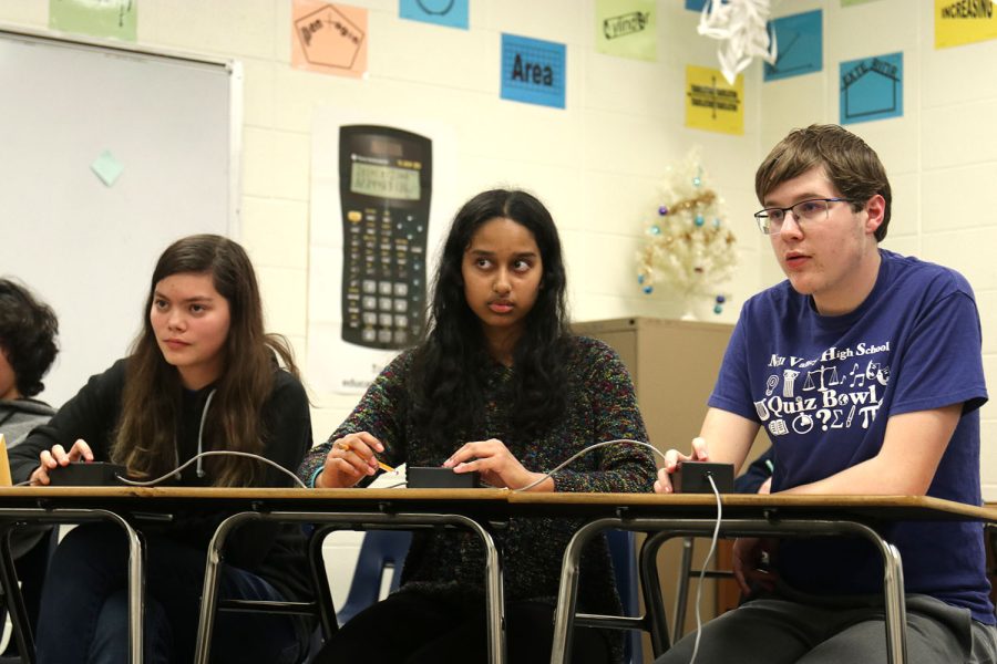 In a tie breaking question, senior Avery Gathright and freshmen Rachel Joseph and Ian Weatherman listen in anticipation to answer without interrupting and risking the loss of points.