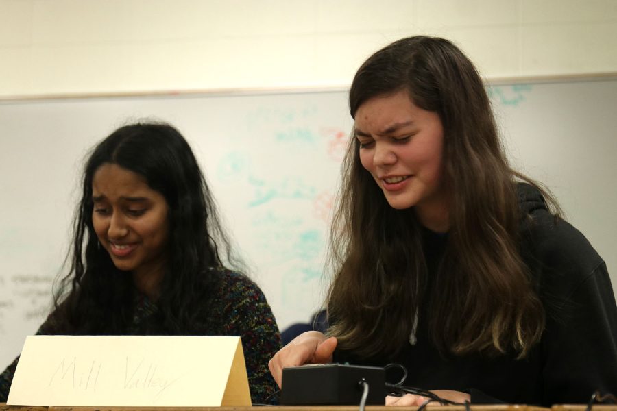 Following a victory for the other team, Avery Gathright and Rachel Joseph laugh as they realize the answer to the question.