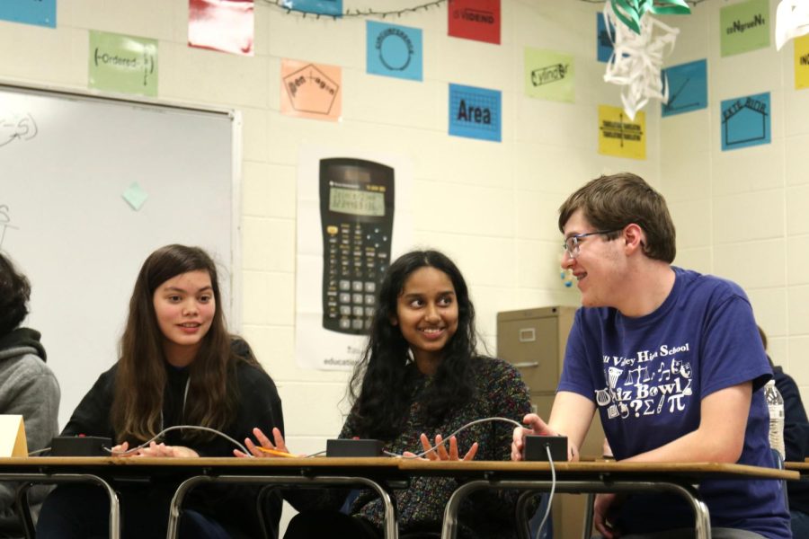 As the three discuss a fine arts question, Avery Gathright, Rachel Joseph and Ian Weatherman make sure that the team agrees with the answer Weatherman suggests.