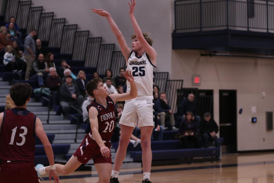 Sophomore Carter Kaifes attempts to shoot the ball in the net against Eudora. 