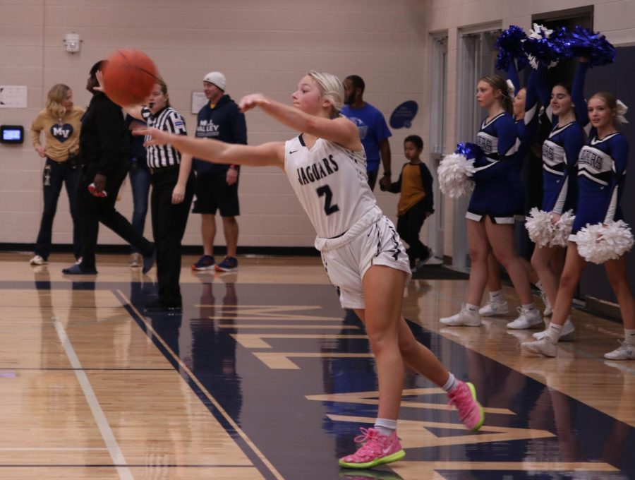 Looking for a teammate, junior Keira Franken throws the ball in bounds to start the next play.