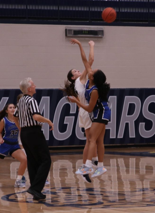 Freshman Paige Roth gets the tip off and starts the game string against Gardner Edgerton.