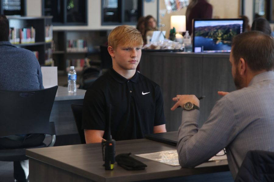 Focused, senior Holden Zigmant listens to his interviewer speak. 