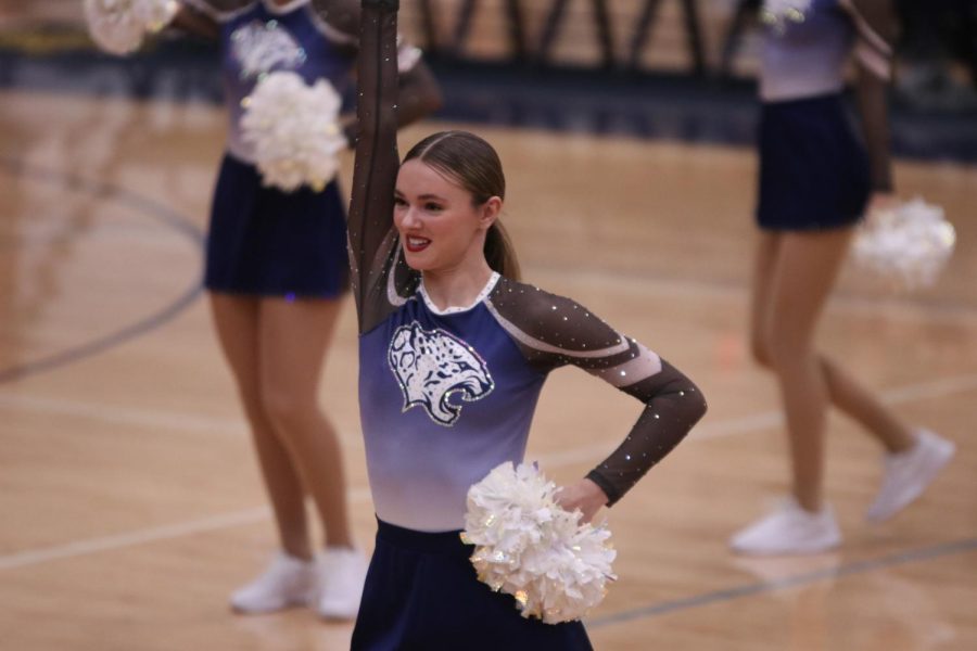 During half time, freshman Brooke Seymour dances with the Silver Stars.