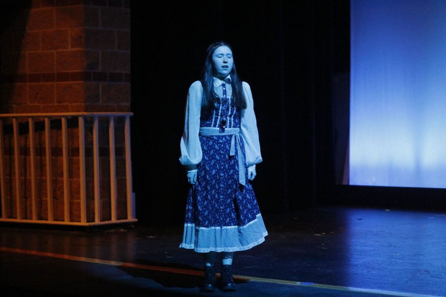 Sophomore Reese Miller playing the lead role of Molly Aster tries to envision herself flying Tuesday, Dec. 6. 