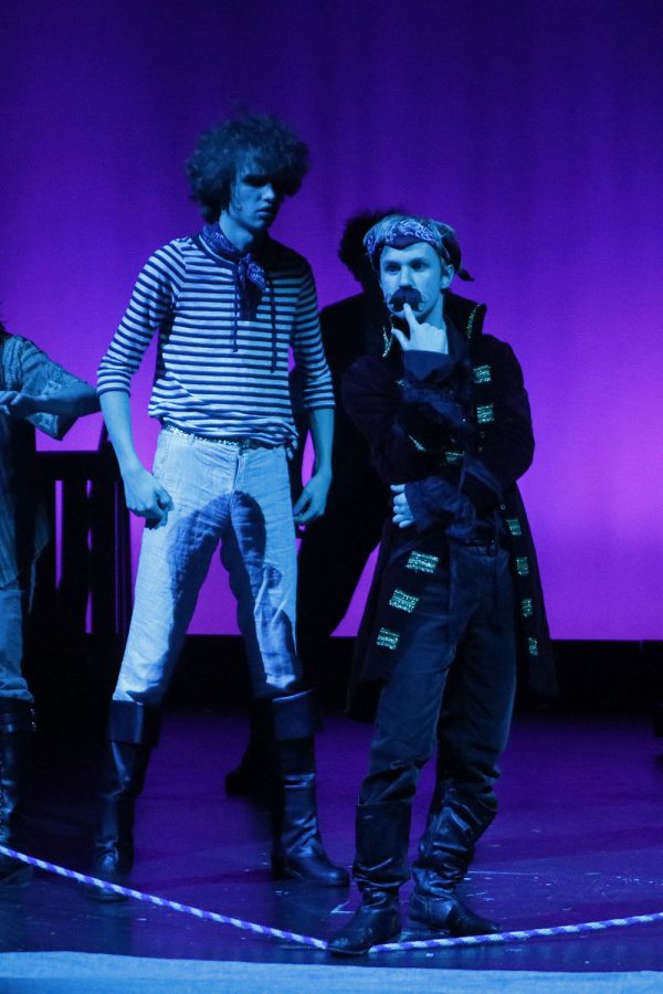 The Black Stache played by senior Carter Harvey, is accompanied by his helpful hand Smee, played by senior Sean Olin, Tuesday, Dec. 9. 