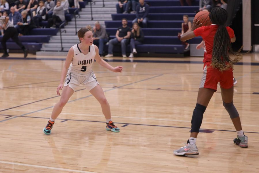 Sophomore Josie Benson pressures the ball carrier into making a pass. 