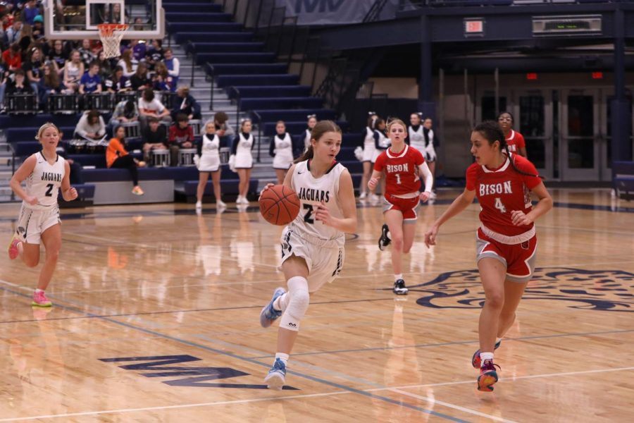 Maneuvering around a defender, sophomore Averie Landon makes her way to the basket.