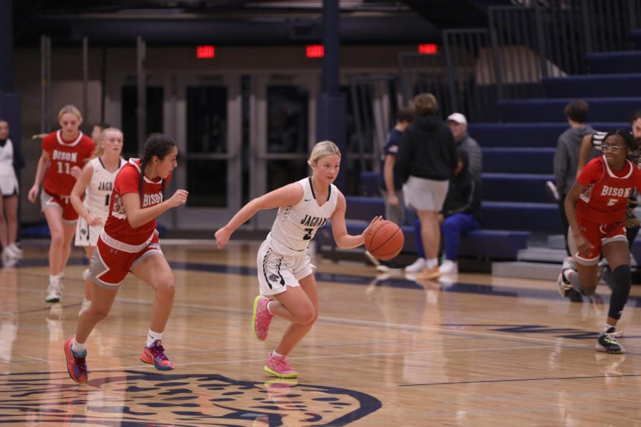 On a break away, junior Keira Franken runs toward the open basket.