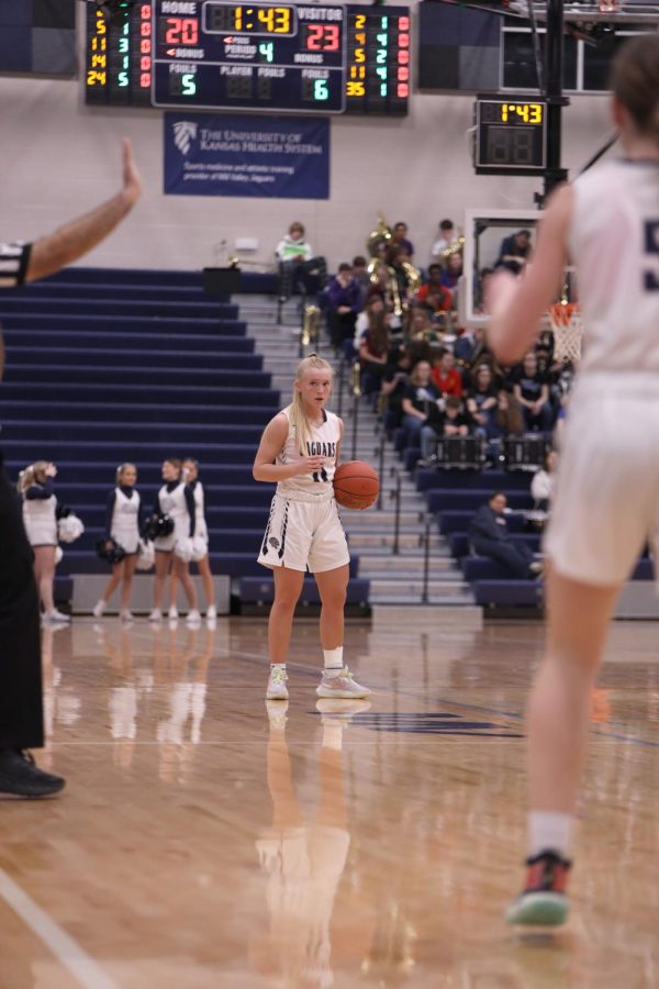 Looking toward the bench, senior Sophie Pringle receives the play call from coach Adam Runyan.