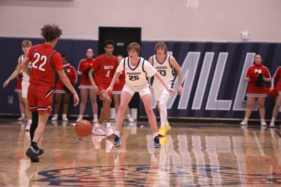 Setting up to defend, sophomore Carter Kaifes awaits the ball carrier. 