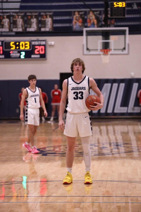 Junior Mason Kemp catches his breath in preparation for a free throw shot. 