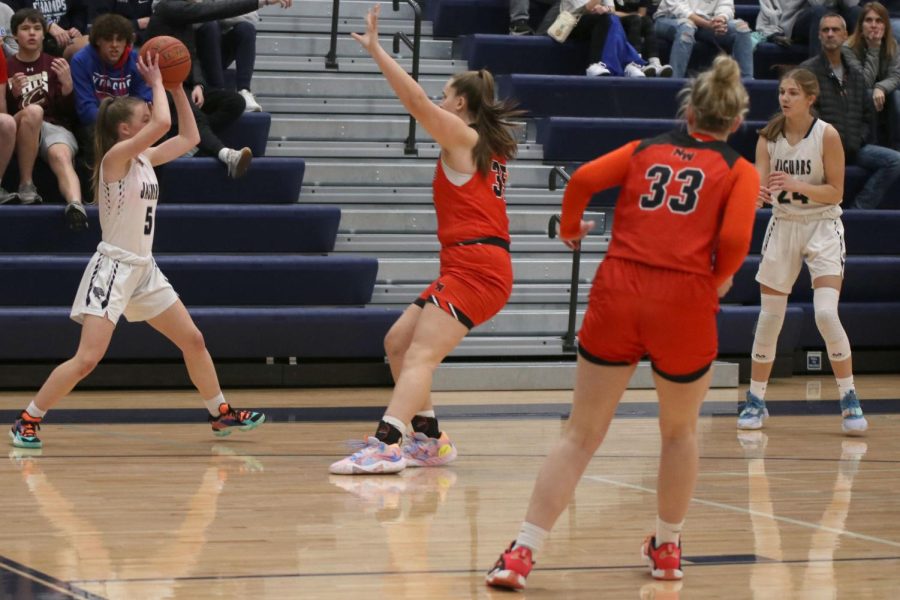 Sophomore Josie Benson passes the ball in from out of bounds.