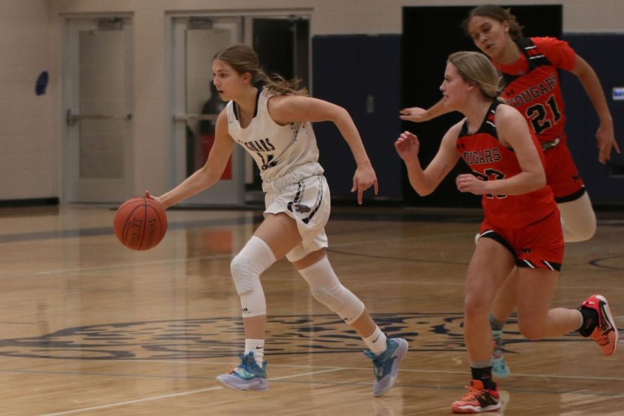 After rebounding the ball, sophomore Averie Landon makes her way to the other basket.