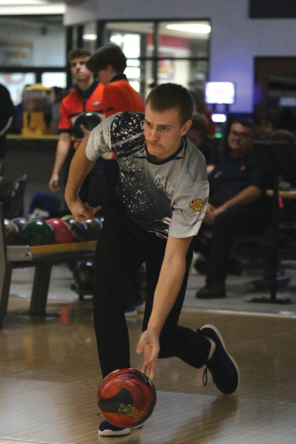 Releasing the ball, senior Preston Oliver aims for a strike.
