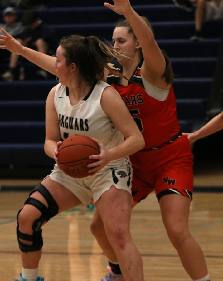 Avoiding the opposing defense, sophomore Morgan Speciale looks for a teammate.