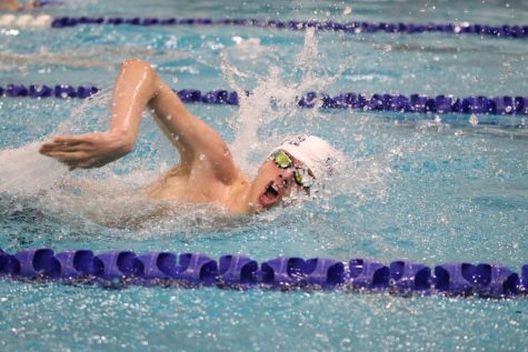 Sophomore Alex Martin takes a breath nearing the end of the 500m