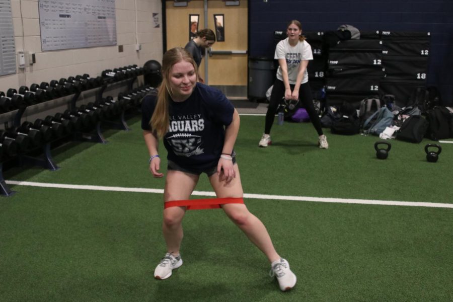 Junior Annabelle Alena walks side-to-side with a band across her legs.