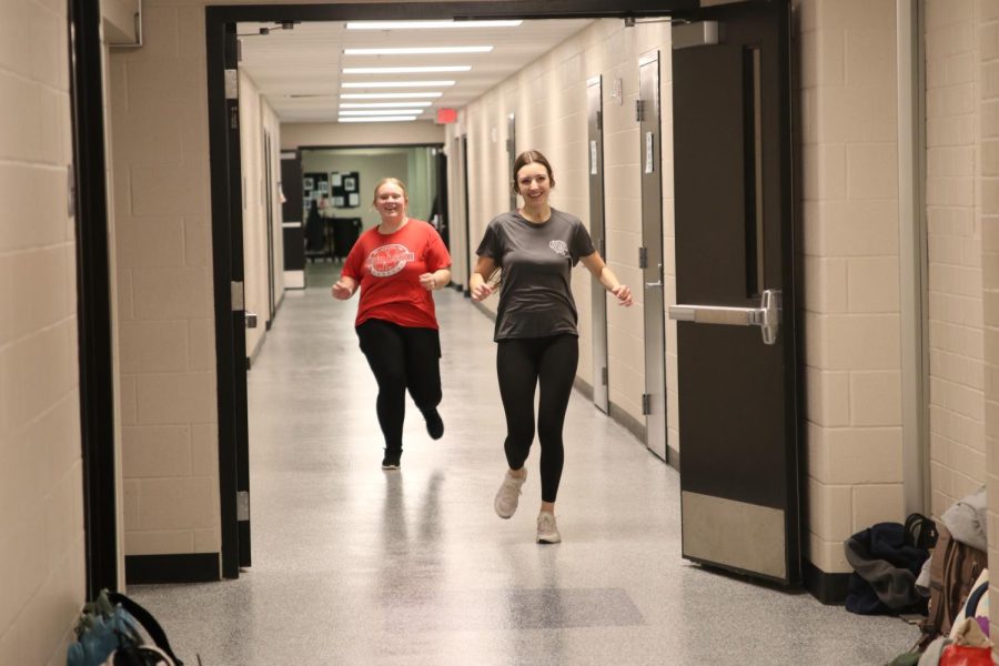 Senior Anna Stottlemyre and Freshman Emma Brooks sprint down the hallway.
