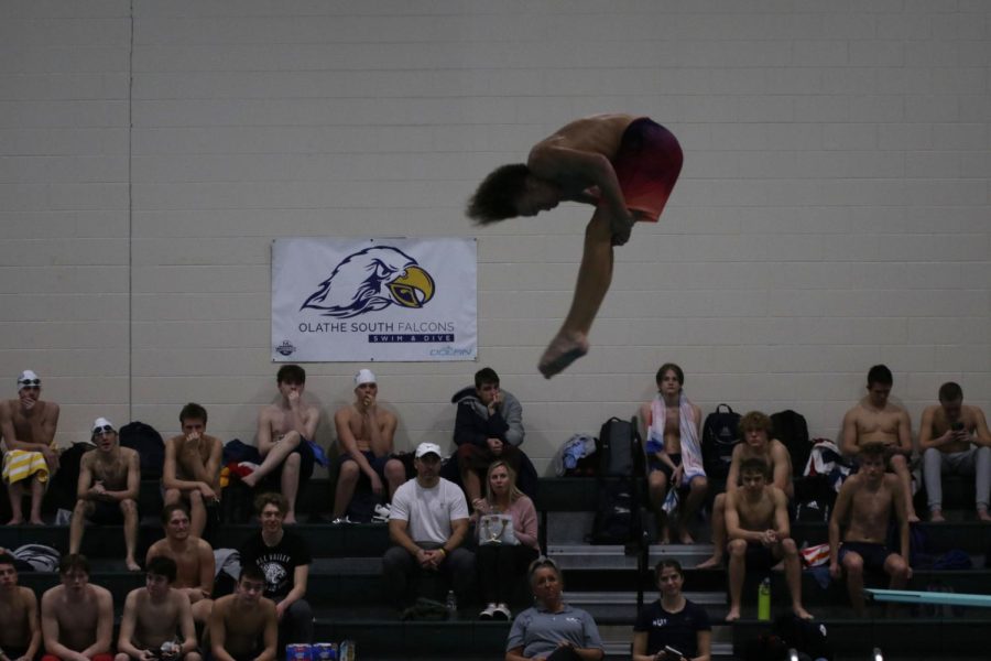 In the pike position, junior Max Roe performs his dive. 

