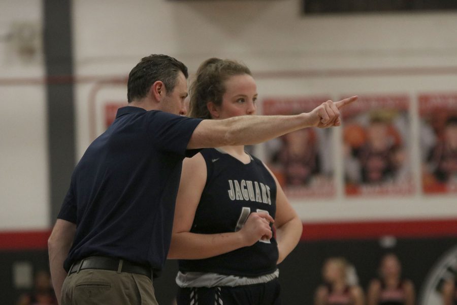 Giving game advice, coach Adam Runyan tells sophomore Morgan Speciale what he wants her to do on offense. 