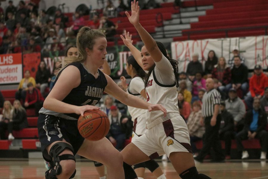 Dribbling backward, sophomore Morgan Speciale creates space from her defender. 
