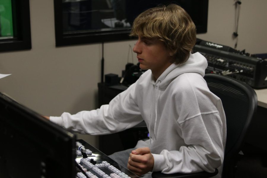 In the studio, senior Alex Shank helps run a sound test for the  MVTV daily announcements, Friday Jan. 27