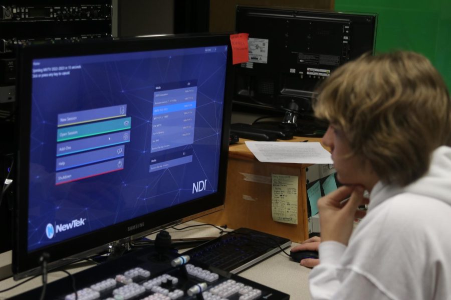 MVTV producer senior Alex Shank uses the broadcast software to prepare for the daily announcements.  
