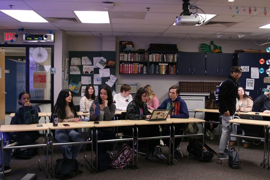 Students converse with one another as they wait for the club meeting to start Tuesday, Jan. 10. 