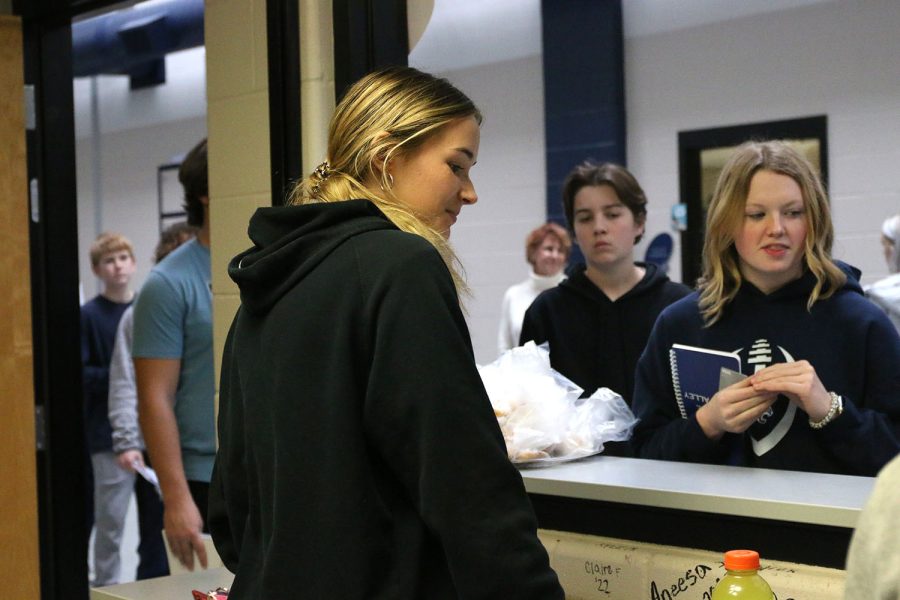 Senior Libby Strathman listens to junior Ella Hansen’s order from the Catty Shack Tuesday, Jan. 24.