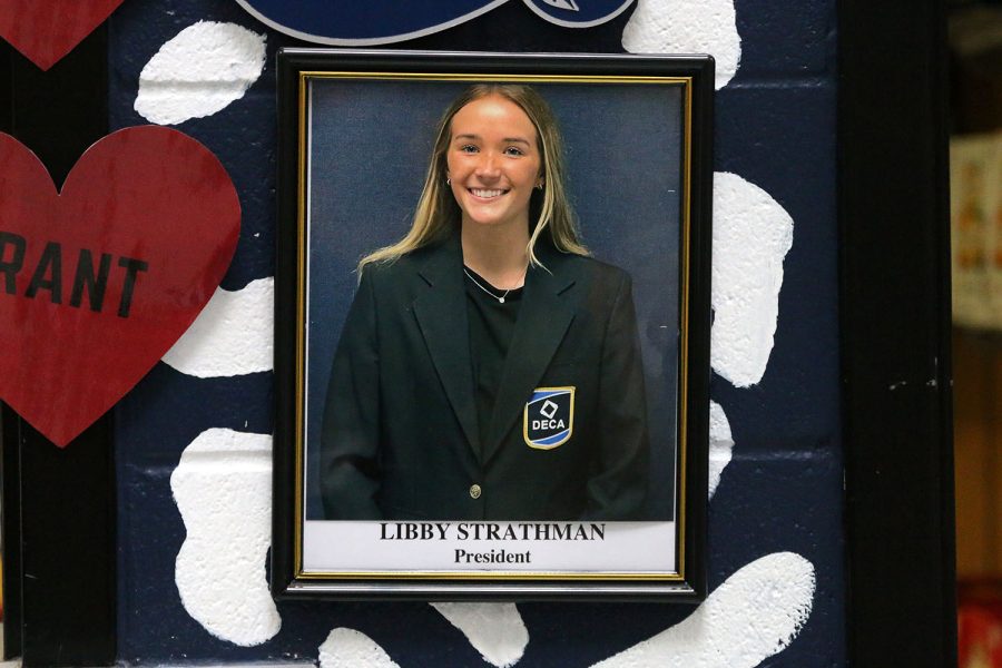 Senior Libby Strathman’s DECA photo hangs on the outside wall of The Catty Shack school store. In addition to serving DECA and The Catty Shack, Strathman is the president of National Honor Society and the senior vice-president of National English Honor Society.