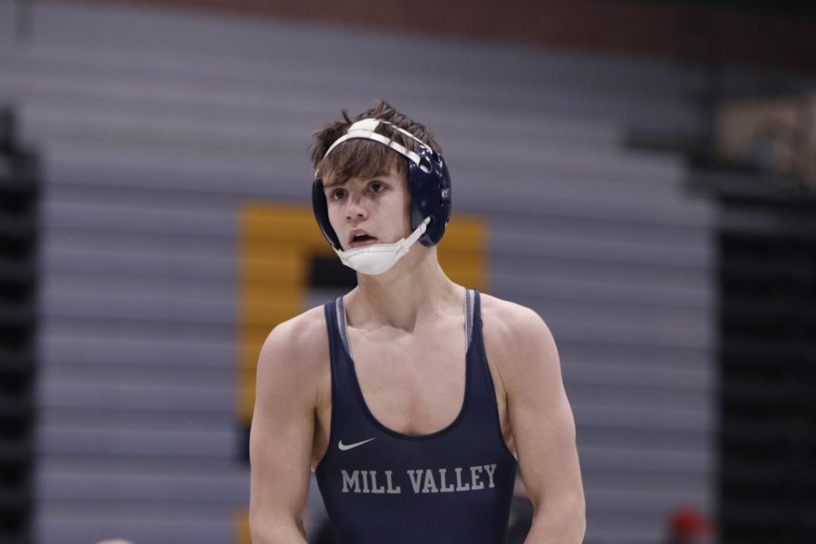 Staring at the score, junior Dillon Cooper has his game face on. 