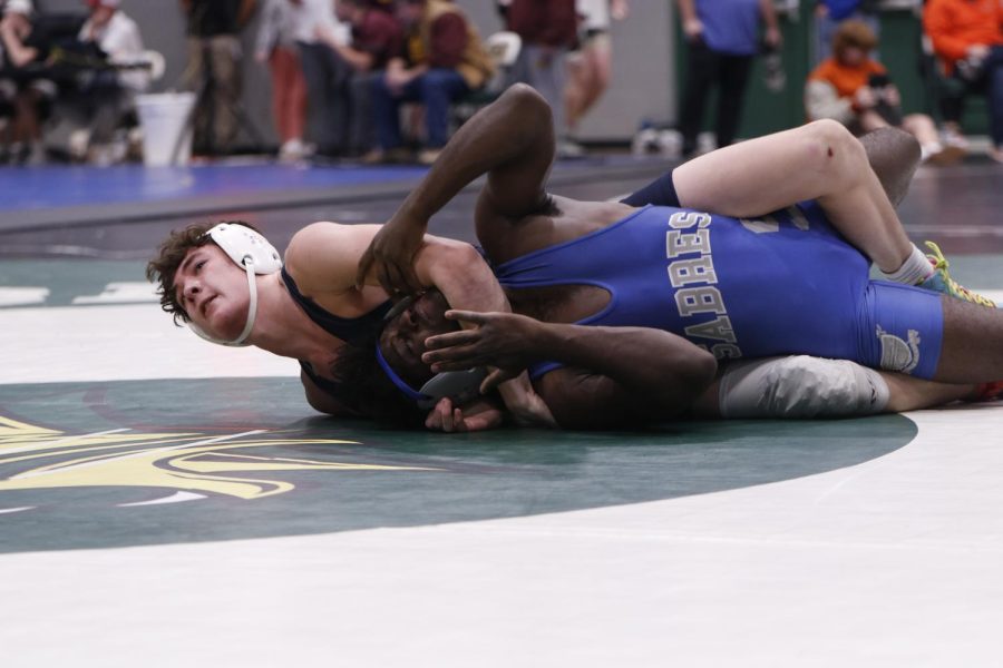 Senior Dylan Massey takes the win against his opponent.