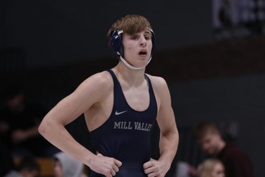 Junior Colin McAlister makes eye contact with Coach Lazor for advice during his duel. 